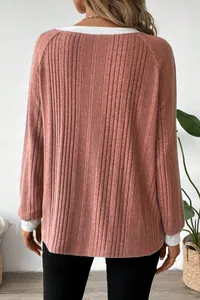 Detailed back view of a dusty rose ribbed long sleeve sweater with white contrast trim