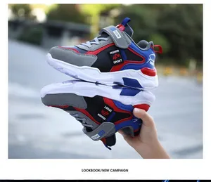 Detail view of boys' waterproof sports shoes featuring blue and red color-blocking