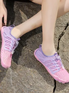 Lightweight pink and purple barefoot water shoes for outdoor hiking and surfing.