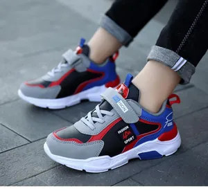 Boys waterproof running shoes in vibrant blue and red colors with secure straps