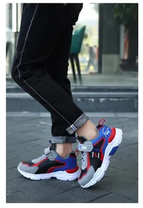 Detail view of boys waterproof sports running shoes with velcro straps in multi-color