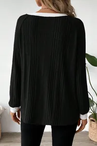 Back view of black ribbed long sleeve sweater with white contrast trim detailing