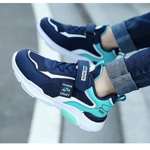 Detailed view of navy and turquoise waterproof sports shoes for boys