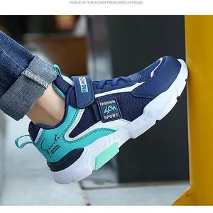 Boys' navy and teal waterproof athletic running sneaker with adjustable Velcro strap closure
