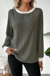 Detail view showing the ribbed knit texture of this grey sweater with white contrast cuffs