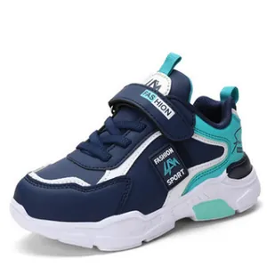 Detailed side view of boys' color-block sneakers with Velcro straps