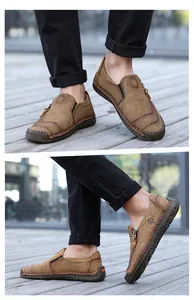 Men's casual leather loafers with side zipper and handmade stitching details worn outdoors