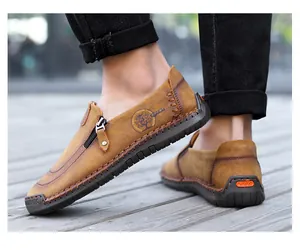 Close-up of men's casual brown leather loafers with side zipper and hand-stitched detail