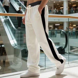 Detailed side view of white heavyweight drawstring sweatpants with black side stripes