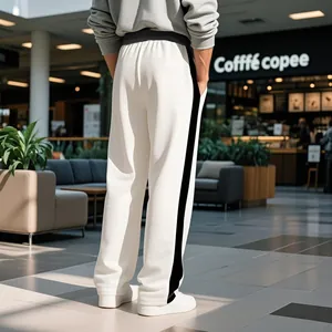 Detailed back view of men's loose off-white sweatpants with contrast black side stripes