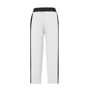 Detailed macro view of white heavy terry cotton sweatpants with black side stripes