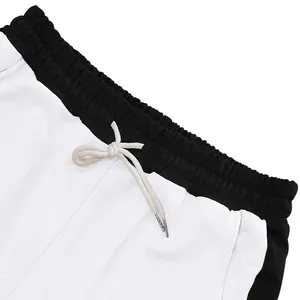 Close-up of drawstring waistband on men's color-block french terry sweatpants