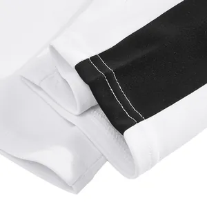Detailed close-up of white heavyweight sweatpants cuff with black side stripe and stitching.