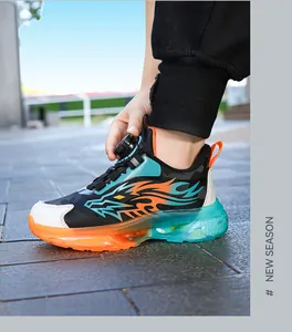 Side view of children's sports shoes with colorful soles and automatic knob laces