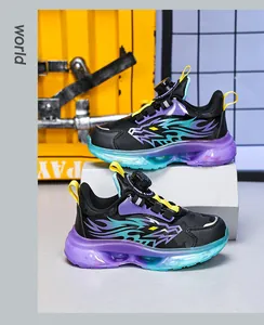 Kids athletic sneakers with rotary buckle system and vibrant purple teal sole