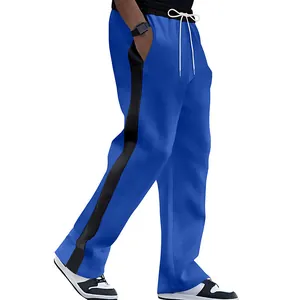 Detail of men's blue straight-leg sweatpants with a stylish black side stripe.