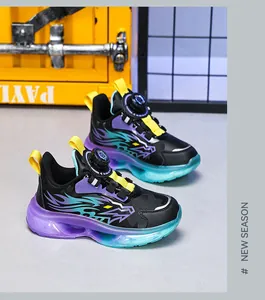 Close-up detail of boys sneakers with automatic rotary buckle and colorful soles