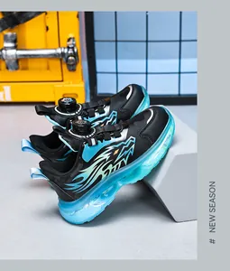 Close-up of boys' sports shoes with rotary buckle and blue translucent thick sole.
