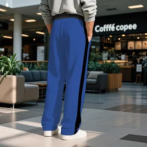 Rear view of men's blue heavy-weight terry sweatpants with black side stripe detail