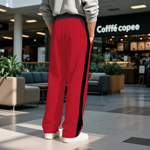 Close-up back view of men's loose fit red sweatpants featuring a bold black side stripe