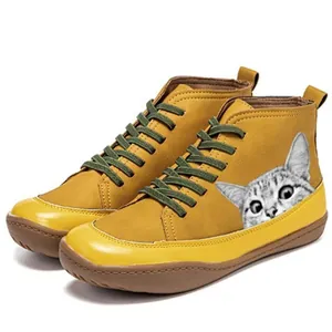 Retro mustard yellow high-top Martin boots featuring green laces and a cute cat print.