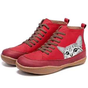 Detailed side view of red retro high-top boots featuring a cute cat face print