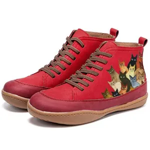 Close-up view of retro red high-top boots featuring a whimsical cat pattern print