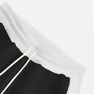Close-up of the white elastic waistband and drawstring on black men's sweatpants
