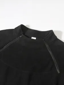 Detailed view of the stand collar and double side zippers on a men's black coral fleece sweatshirt