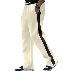 Close-up side view of men's heavy-weight cream sweatpants with black side stripes