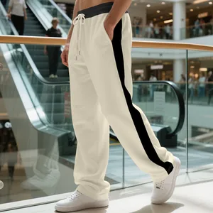 Heavyweight men's cream drawstring sweatpants featuring a contrast black side stripe