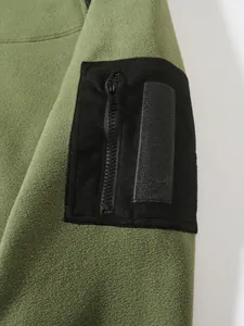 Detail of men's olive green coral fleece sweatshirt featuring a black sleeve pocket.