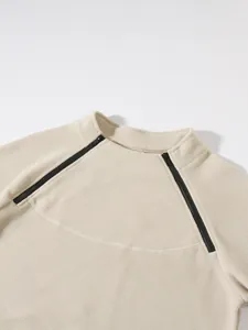 Close-up detail of men's soft coral fleece sweatshirt with unique double zipper collar