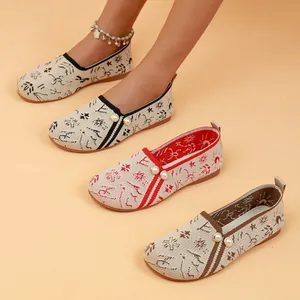 Detail view of knitted women's loafers with pearl accents in three color options