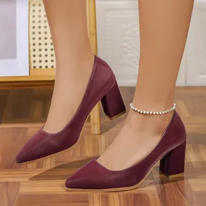 Side view of wine red pointed-toe block high heels with white bead anklet detail