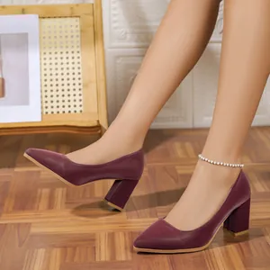 Elegant burgundy pointed toe block heel pumps featuring a sleek professional French style