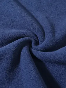 Close-up macro shot showing the soft, warm texture of blue coral fleece hoodie fabric