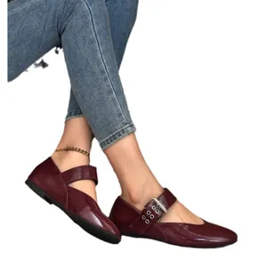Elegant burgundy patent leather Mary Jane flats featuring an adjustable buckle strap for women