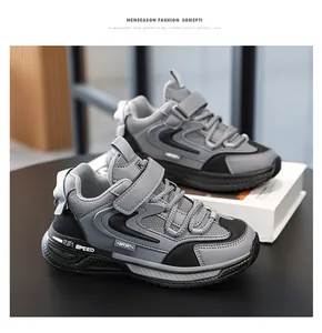 Grey and black boys' chunky sneakers featuring a breathable mesh and leather upper