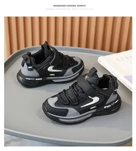 Stylish boys' black leather sports shoes with mesh detail and chunky sole for kids