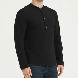Side view detail of a black slim-fit long-sleeve Henley shirt with wood-tone buttons