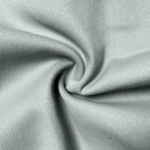 Close-up macro detail showing the premium light grey ribbed fabric texture of men's cargo pants