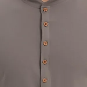 Detailed macro view showing the brown wooden buttons on a grey Henley t-shirt placket