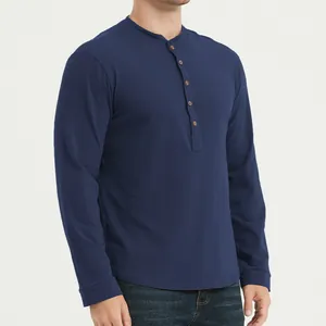 Close-up detail view of a navy blue long-sleeve Henley shirt featuring a buttoned placket.