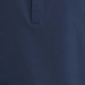 Close-up of navy blue long-sleeved Henley shirt showing fabric texture and stitching