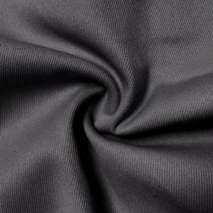 Macro view showing the breathable and durable dark gray fabric texture for men's cargo pants