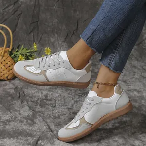 Stijlvolle dames vintage GAT sneakers in wit en grijs met een zachte rubberen zool