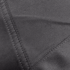High-resolution close-up of gray cargo pants showing fabric texture and double stitching
