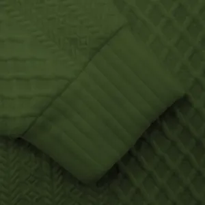 Nahaufnahme von olivgrünem Jacquard-Strickstoff und geripptem Ärmelbündchen-Detail