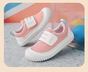 Close-up of pink breathable mesh toddler sneakers with velcro strap and KIDS print